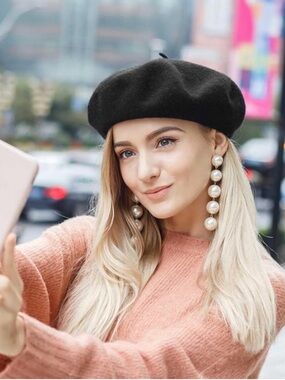 Kate Spade New wool beret features a signature metal logo plaque